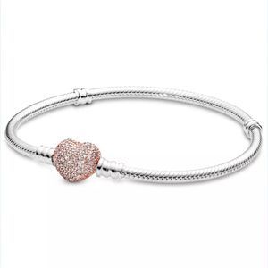 Silver charm bracelet with rose gold pave heart lock. 21cm